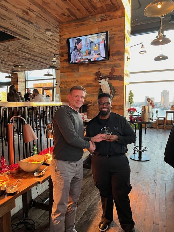 One of the best reasons to recognize employees is to show you appreciate their work, as our president is doing in this photo.