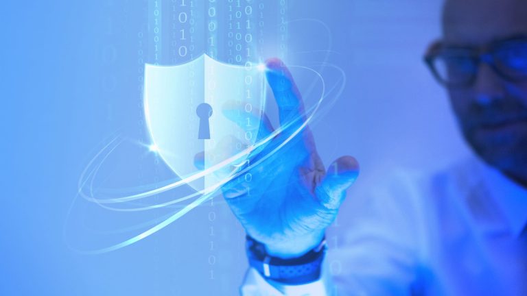 Man touching a padlock shield icon.